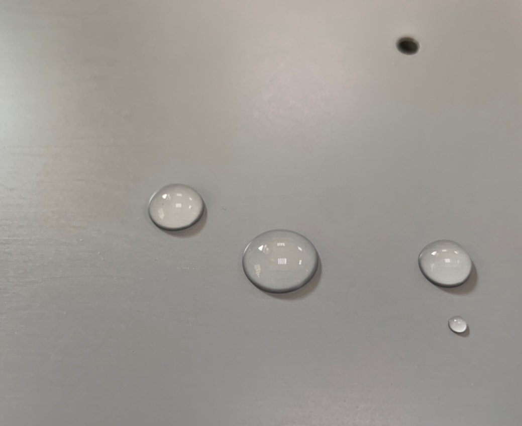 Uncoated surface with poor hydrophobicity and low contact angle.