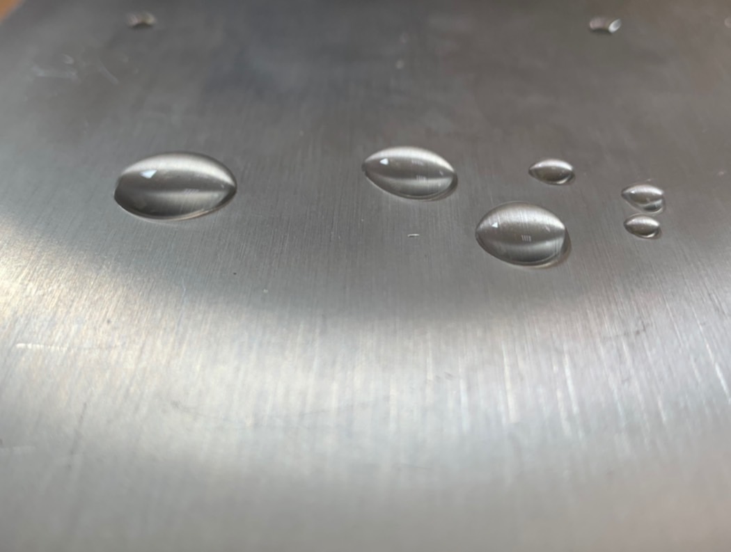 Coated surface with excellent hydrophobicity and high contact angle.